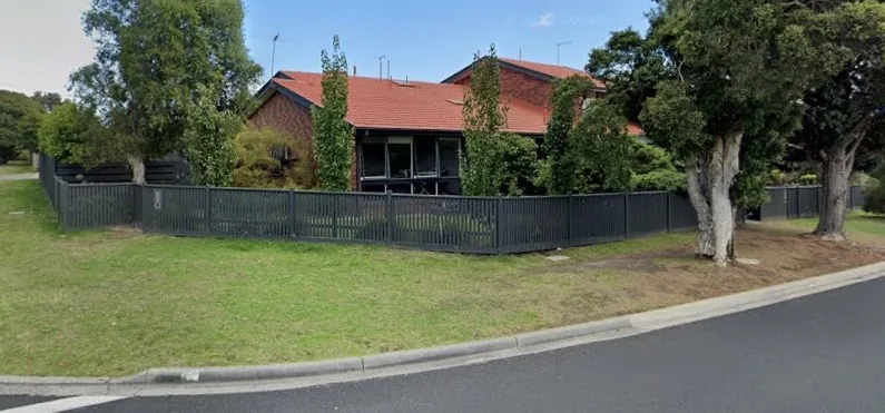 Painted fence around a residential property