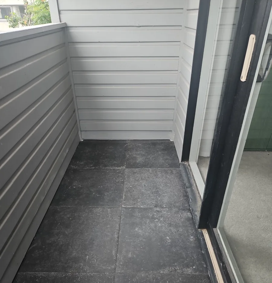 New dark external anti-slip tiles installed on Brighton East balcony